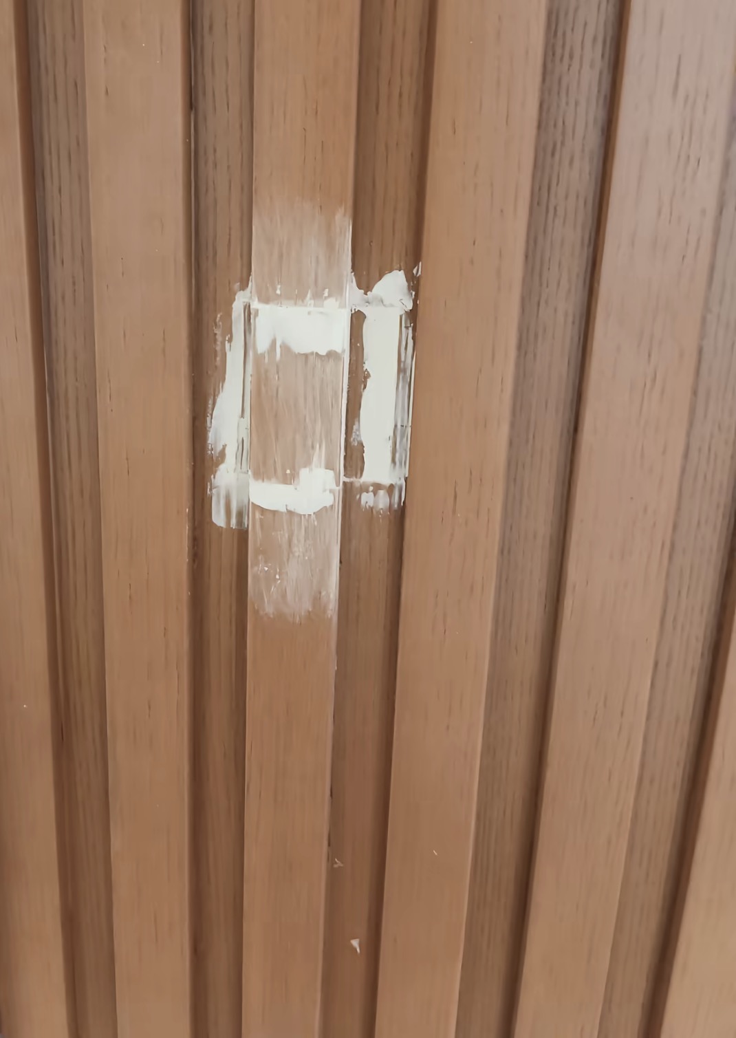 Wood-Grain Profile Repair — In Progress: Filling and preparation around the damaged section.