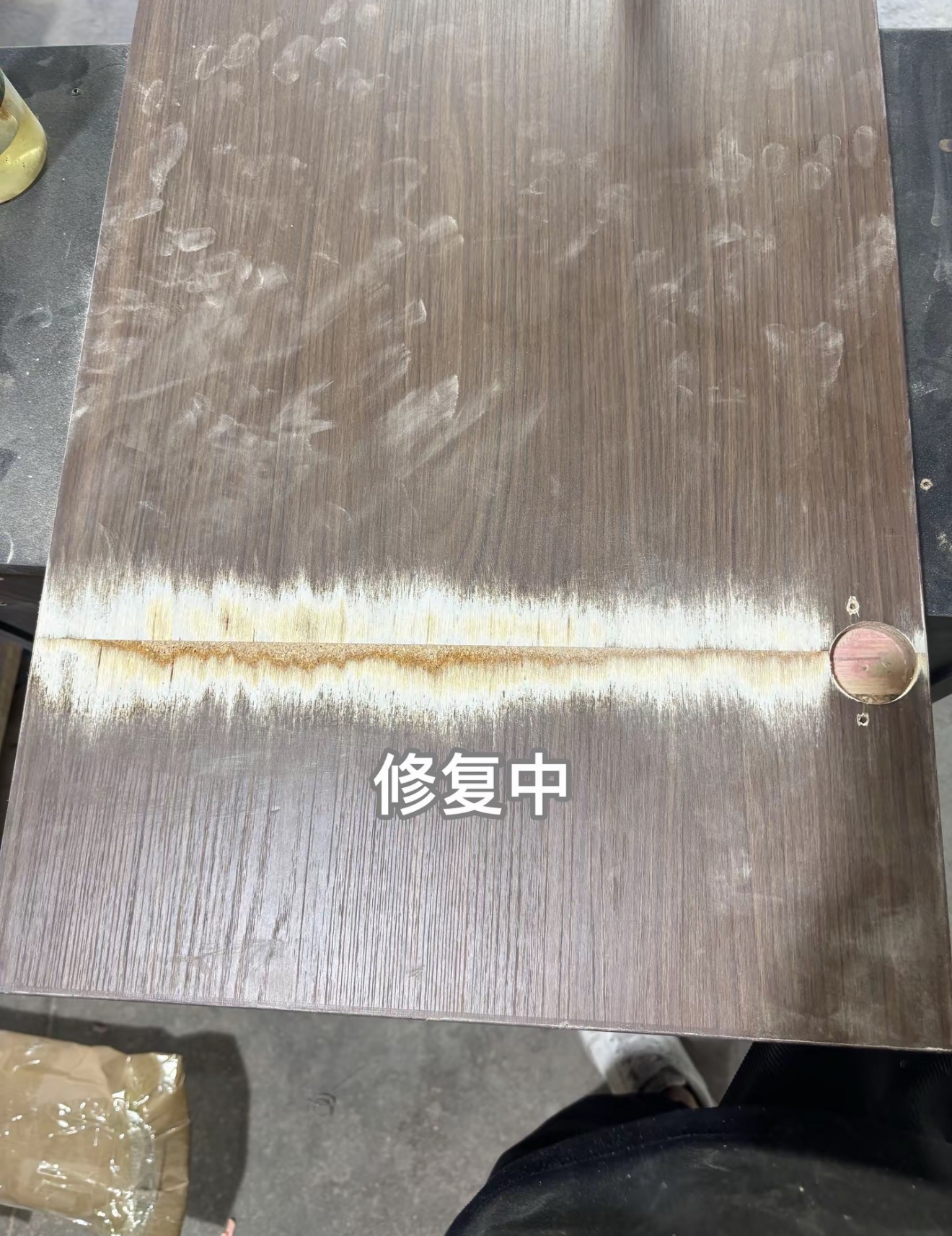 Wooden Door Surface Restoration — In Progress: The affected area during preparation and filling.