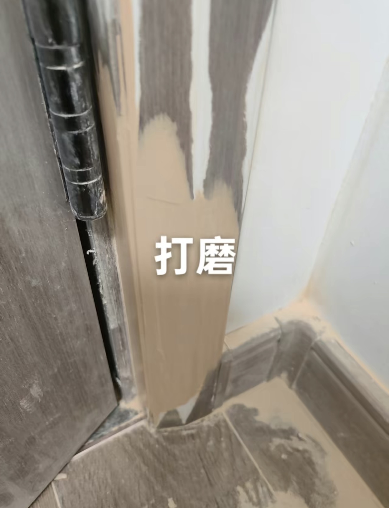 Pet-Damaged Door Frame Repair — In Progress: Sanding and shaping the repair.