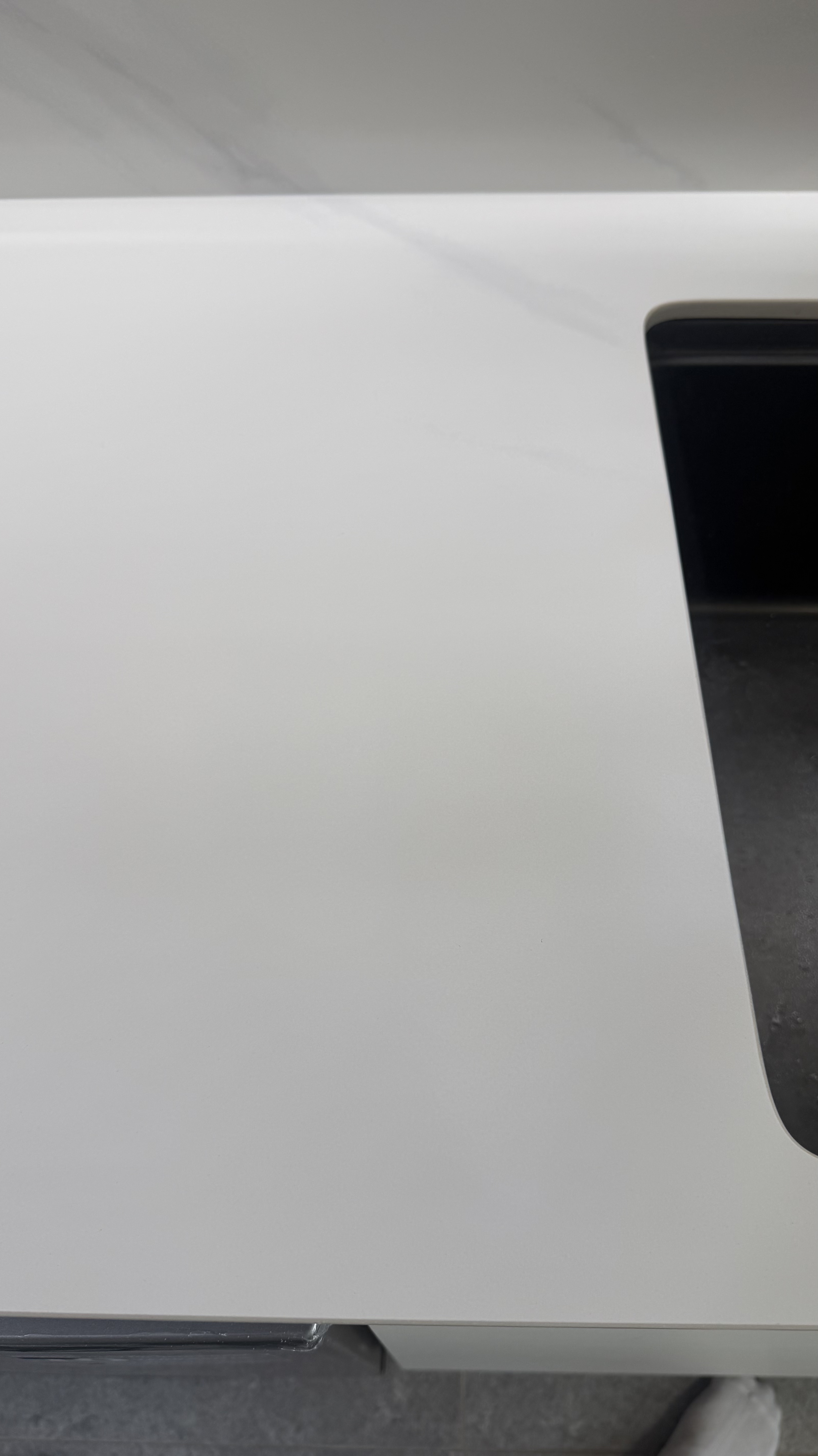 White Countertop Crack Repair — After: The same area after repair and surface finishing.