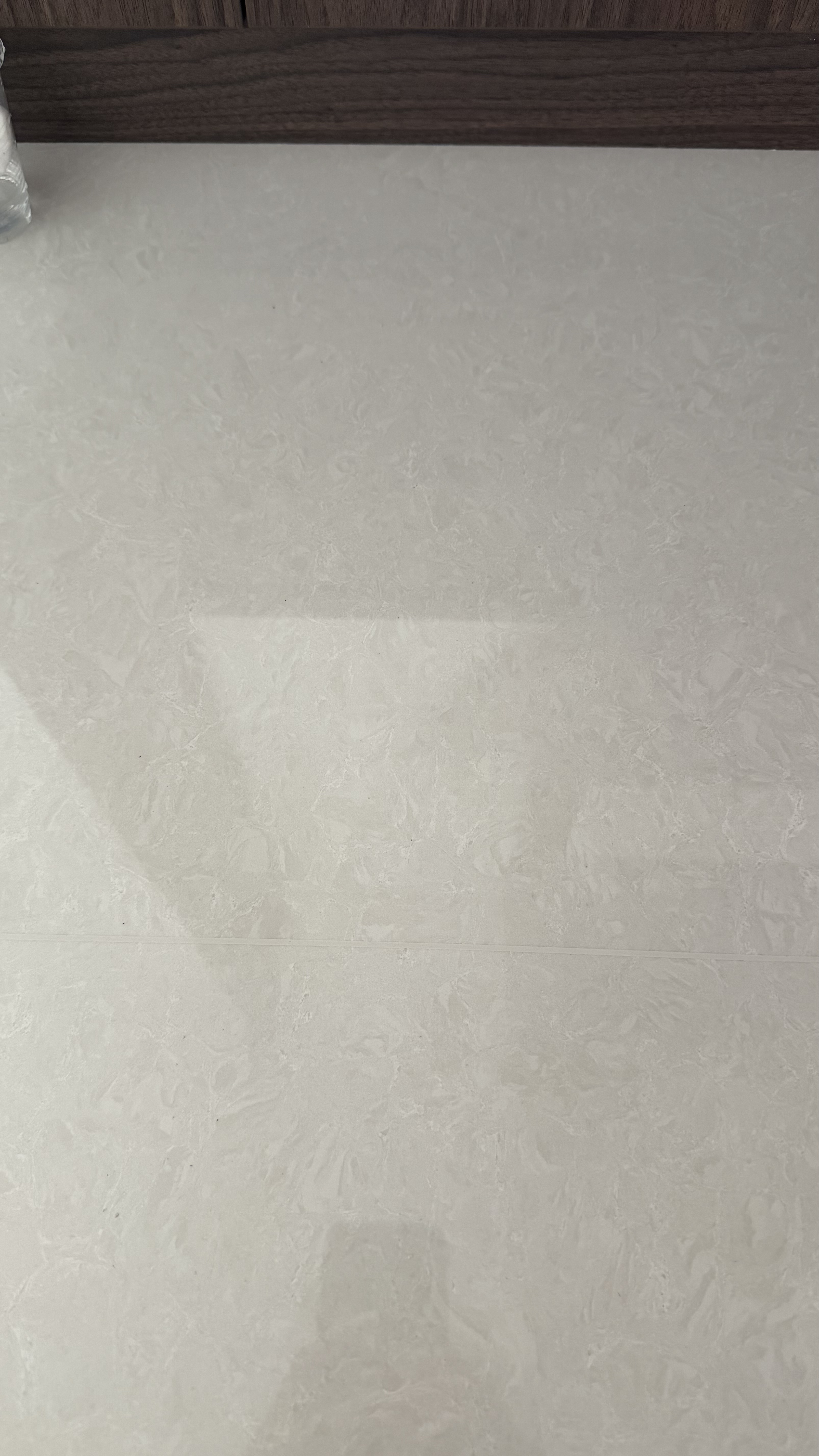 Floor Tile Scratch Repair — After: The same floor tile area after scratch treatment.