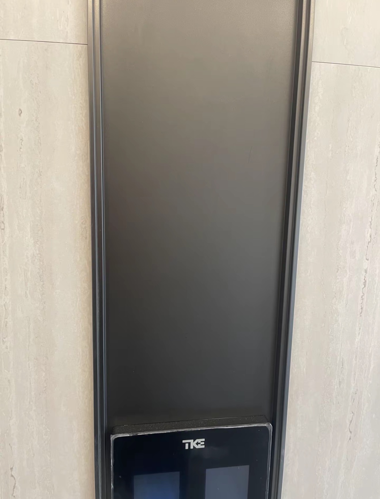 Stainless Steel Door Surround Scratch Repair — After: The same door surround panel after scratch repair and refinishing.