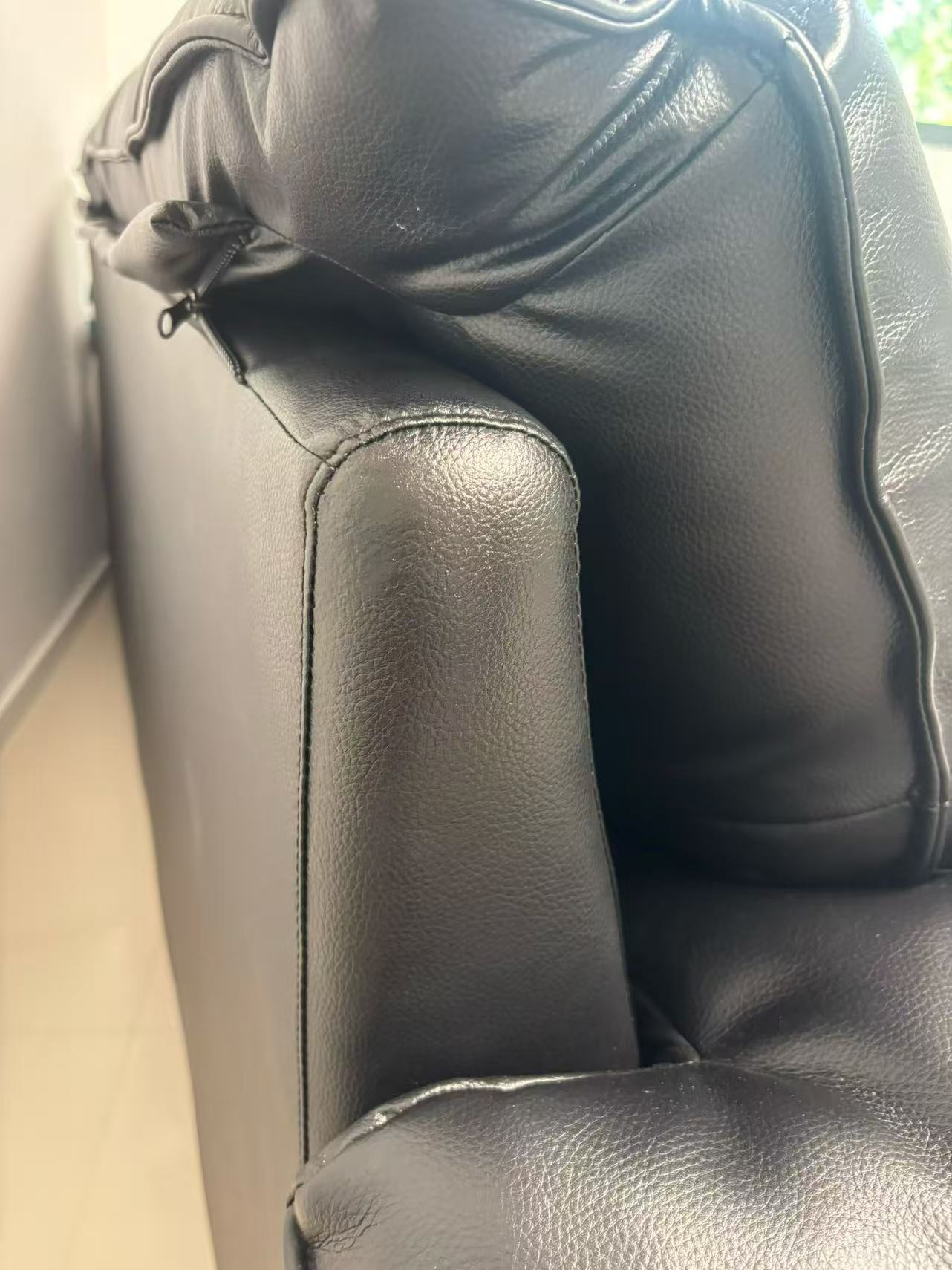 Black Leather Sofa Armrest Repair — After: The same armrest after repair.