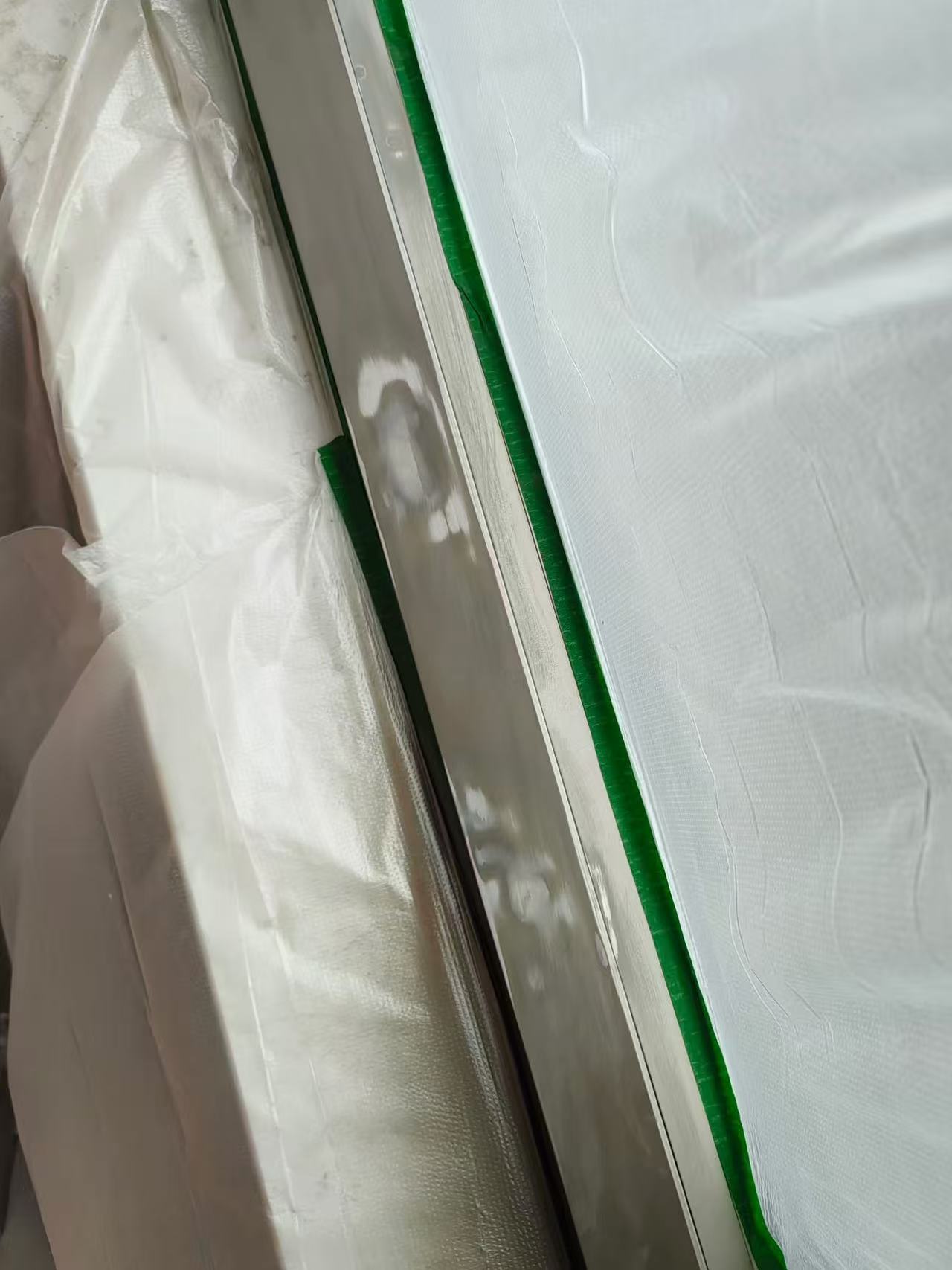 Metal Frame Side Refinishing — Before: Prepared repair areas on the metal frame before finishing.