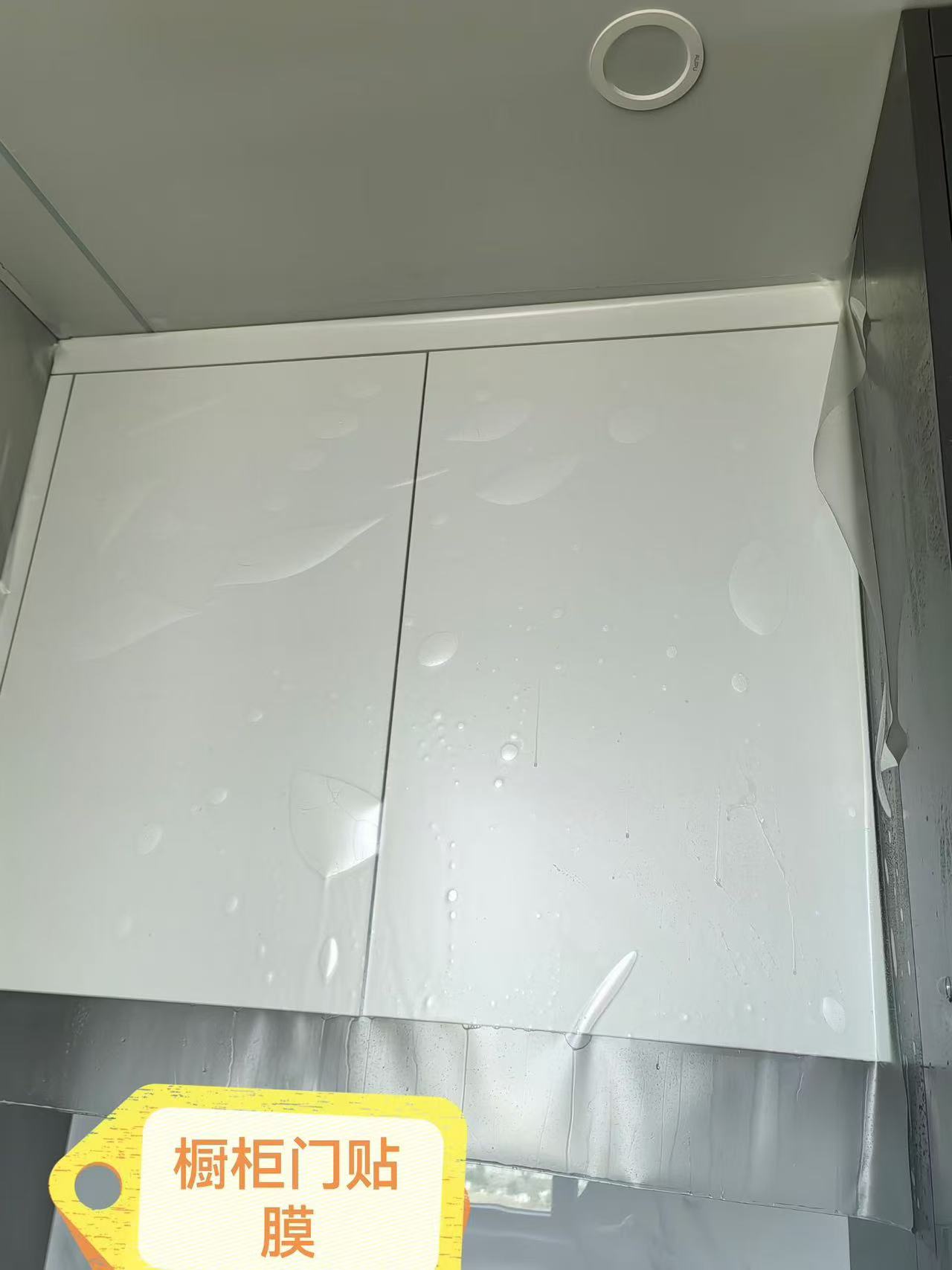 Marble Protection - Photo 1 — Project Photo: Cabinet doors during protective film installation.