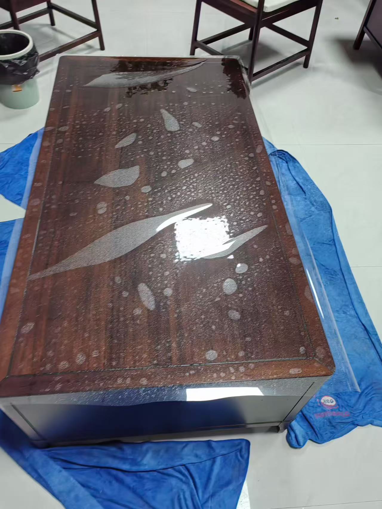 Marble Protection - Photo 7 — Project Photo: Coffee table during protective film installation.
