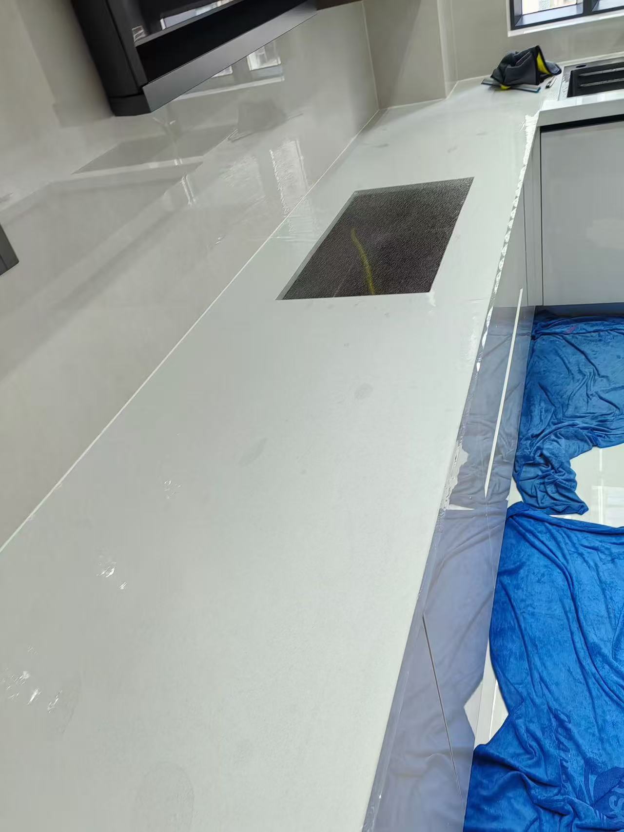 Marble Protection - Photo 9 — Project Photo: Kitchen worktop during protective film installation.