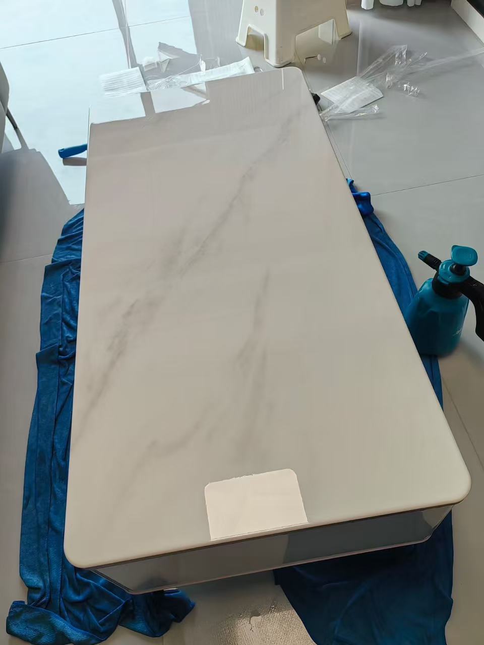Marble Protection - Photo 14 — Project Photo: Light-coloured coffee table with protective film applied.