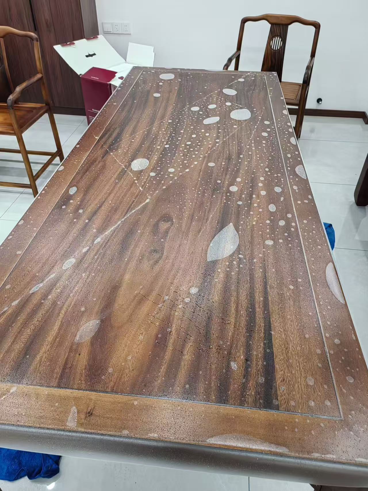 Marble Protection - Photo 15 — Project Photo: Wooden dining table during protective film installation.