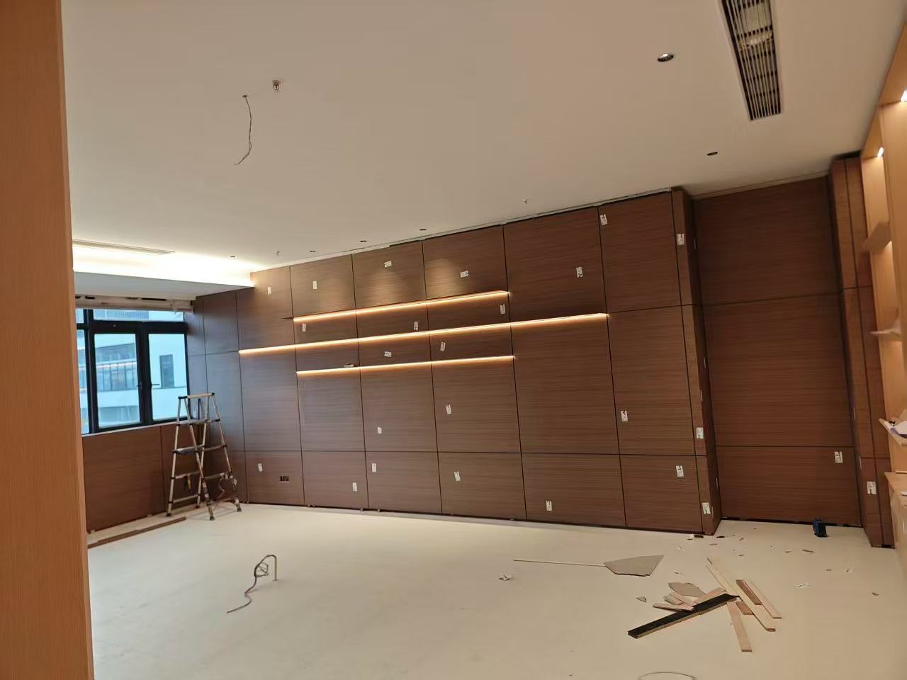 Custom Carpentry & Installation - Photo 2 — Project Photo: Timber wall panelling during installation.