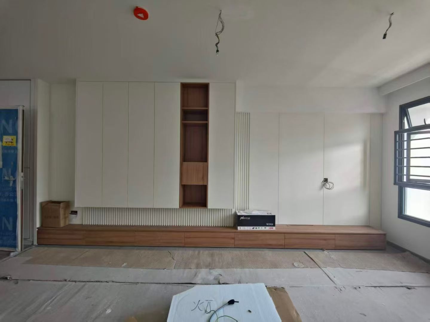 Custom Carpentry & Installation - Photo 8 — Project Photo: Built-in living room storage and TV console.