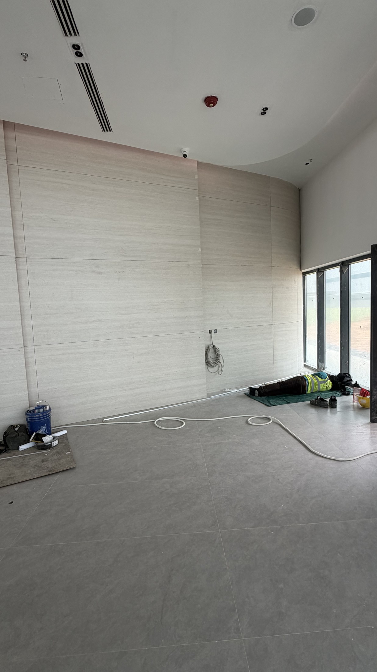 Tile Grouting - Commercial Wall and Floor Project — In Progress: Large-format wall and floor tiles at the project site.