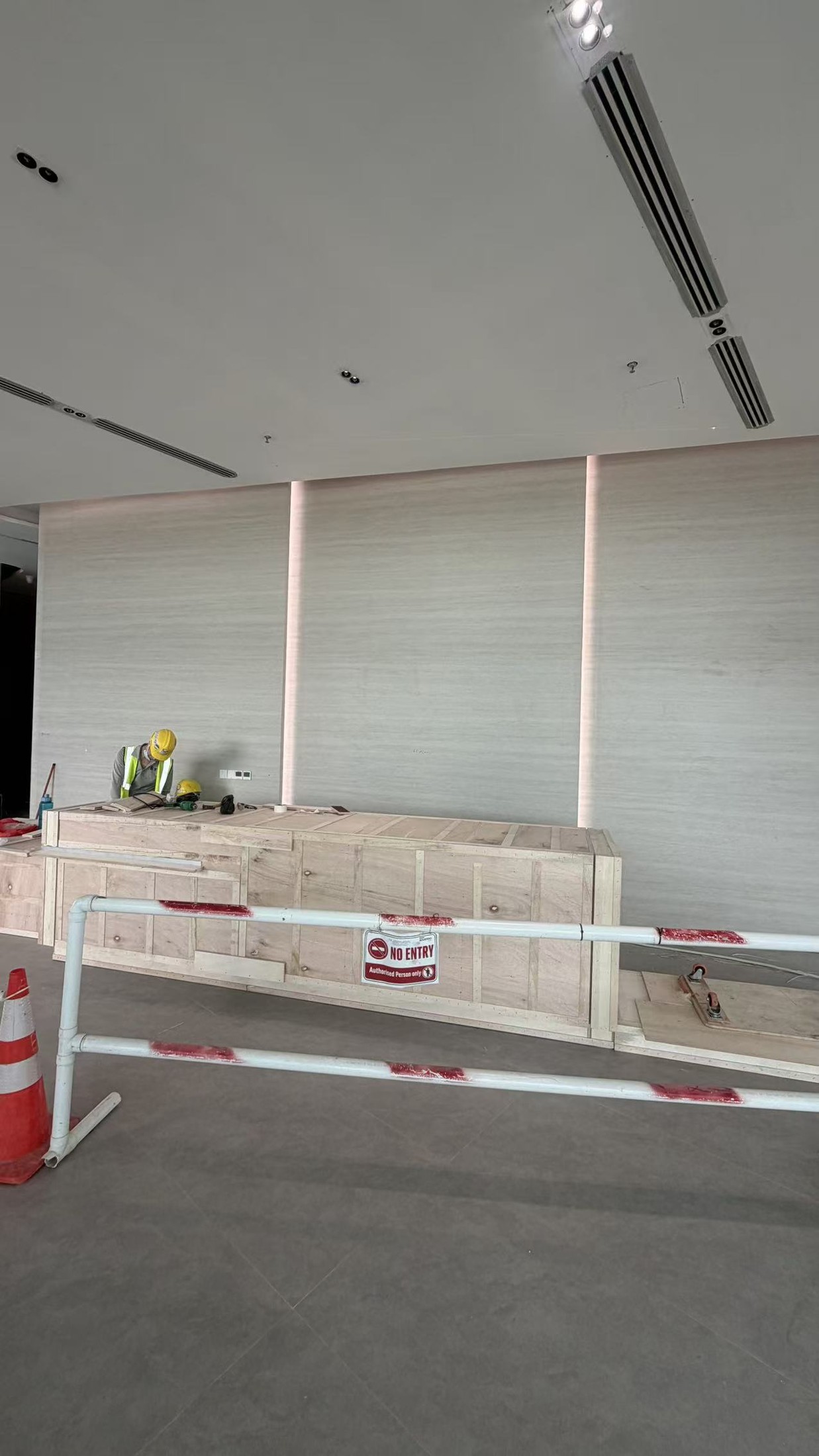 Tile Grouting - Commercial Wall and Floor Project — In Progress: Wall tile joints and recessed lighting during site works.